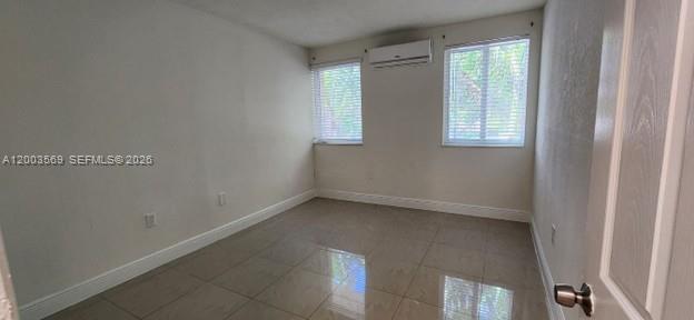 1 Northeast 78th Street, Unit 9 Miami, FL 33138 - Photo 3 of 4 an empty room with windows
