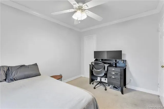 a bedroom with a bed and a chair