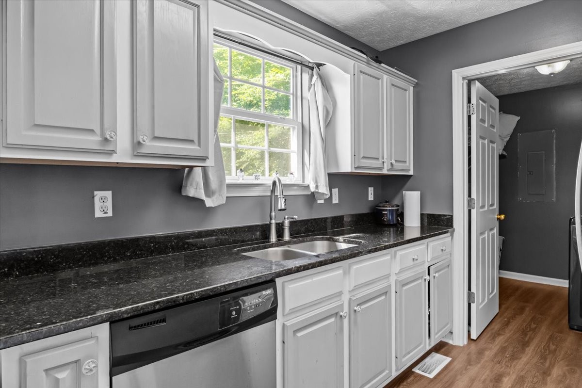 7173 New Hope Road Fairview, TN 37062 - Photo 11 of 31 a kitchen with granite countertop white cabinets and a sink