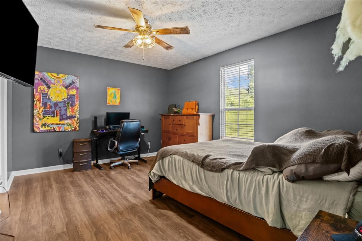 7173 New Hope Road Fairview, TN 37062 - Photo 15 of 31 a bedroom with a bed furniture and a window