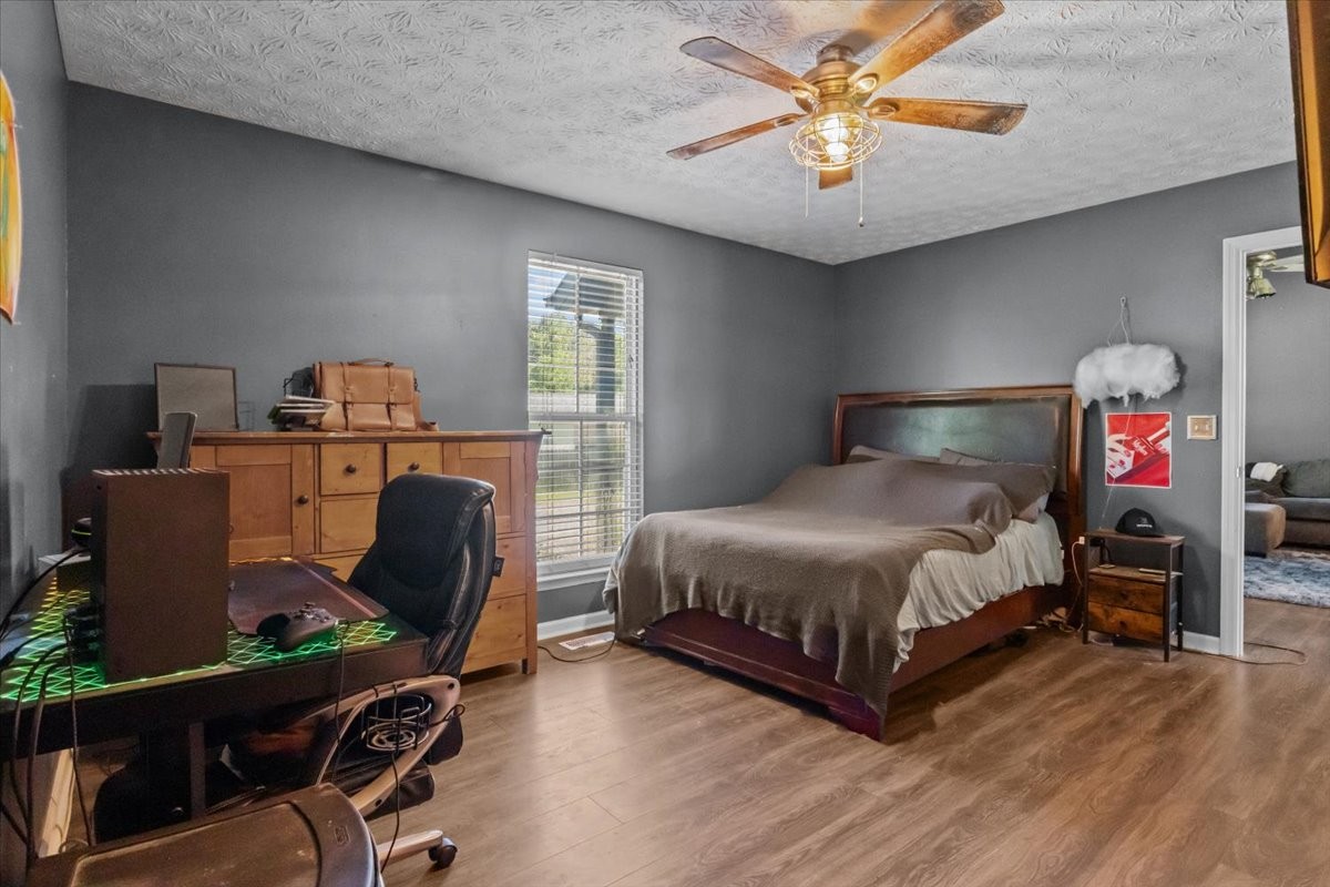 7173 New Hope Road Fairview, TN 37062 - Photo 17 of 31 a bedroom with a bed and a desk