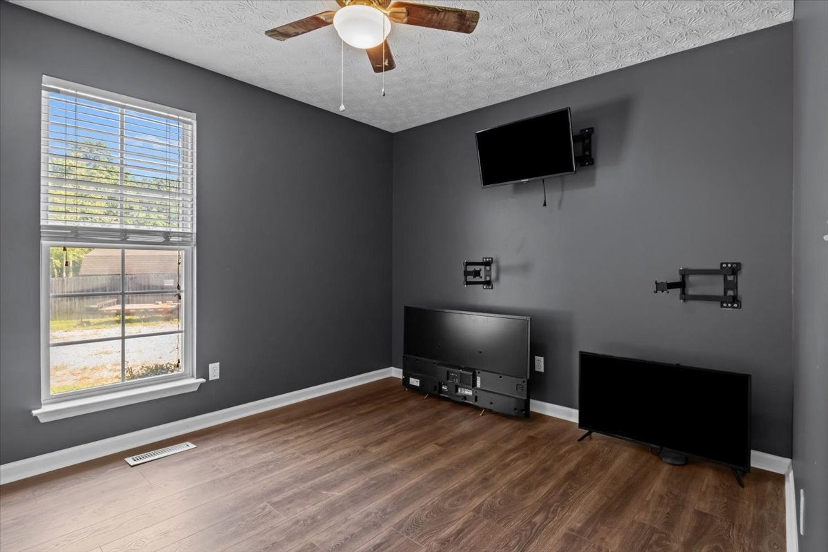 7173 New Hope Road Fairview, TN 37062 - Photo 20 of 31 a living room with furniture and a flat screen tv