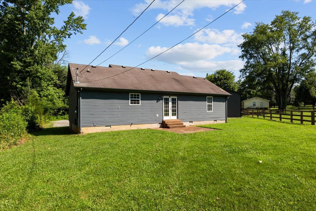 7173 New Hope Road Fairview, TN 37062 - Photo 31 of 31 a front view of a house with a garden and trees