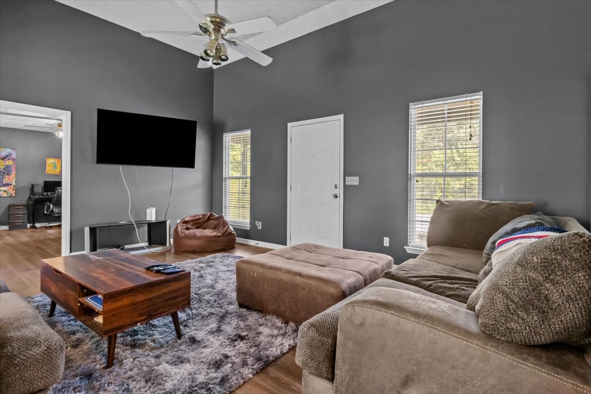 7173 New Hope Road Fairview, TN 37062 - Photo 5 of 31 a bedroom with a bed a flat screen tv and a couch