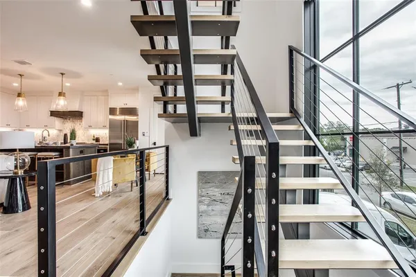 a living room with lots of furniture and a wooden floor