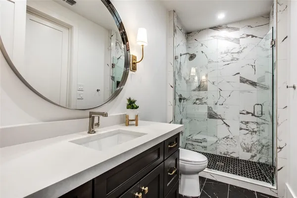 a view of a bathroom with tub and shower