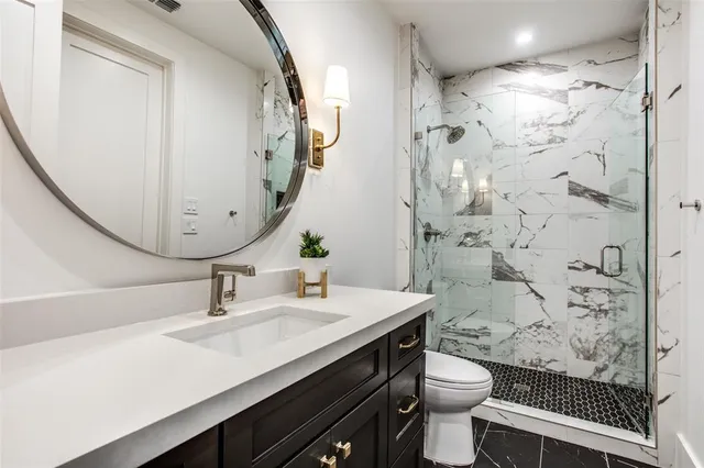 a view of a bathroom with tub and shower
