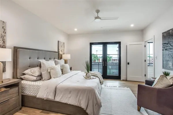 a spacious bedroom with a bed and furniture