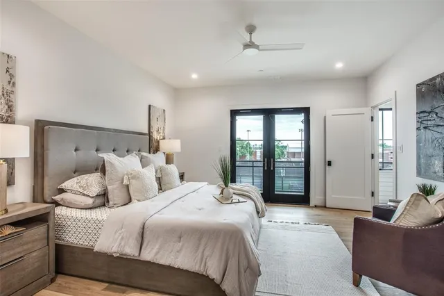 a spacious bedroom with a bed and furniture