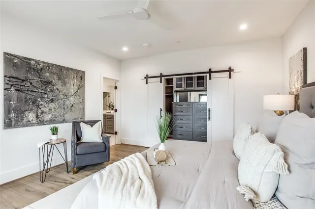 a bedroom with double bed and a window