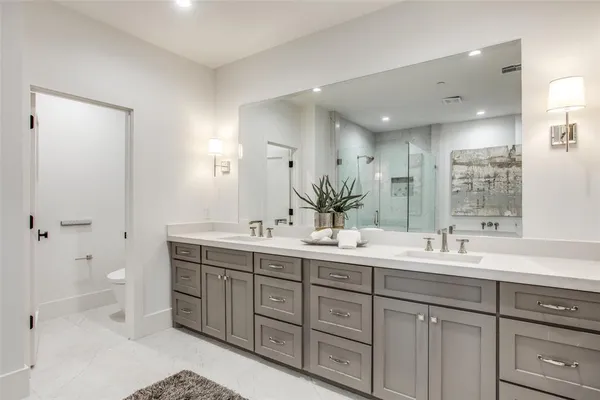 a spacious bedroom with a bed and furniture