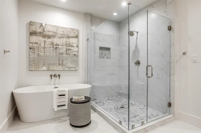 a bathroom with a double vanity sink mirror and toilet