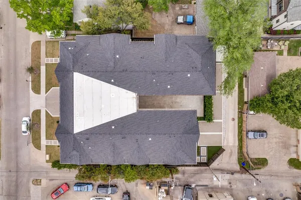 a bathroom with a shower a mirror and a sink