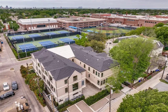 aerial view of house with a yard and a tub