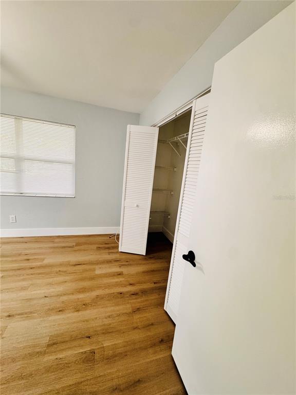 2837 18th Avenue North St. Petersburg, FL 33713 - Photo 18 of 28 a view of an empty room with wooden floor and cabinet