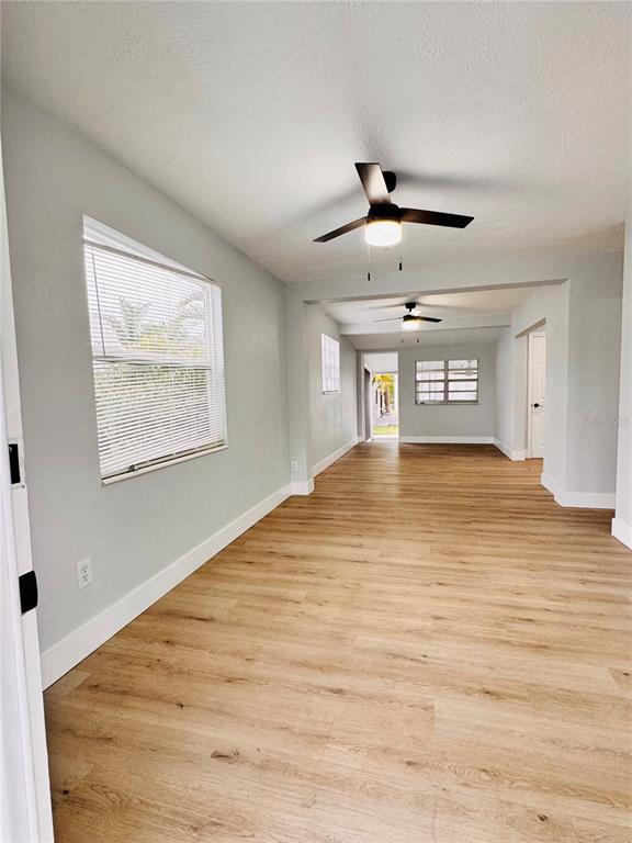 2837 18th Avenue North St. Petersburg, FL 33713 - Photo 4 of 28 a view of an empty room with wooden floor and a window