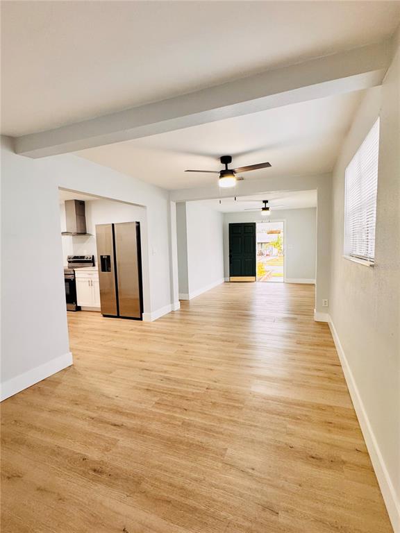 2837 18th Avenue North St. Petersburg, FL 33713 - Photo 5 of 28 a view of a livingroom with wooden floor fireplace and window