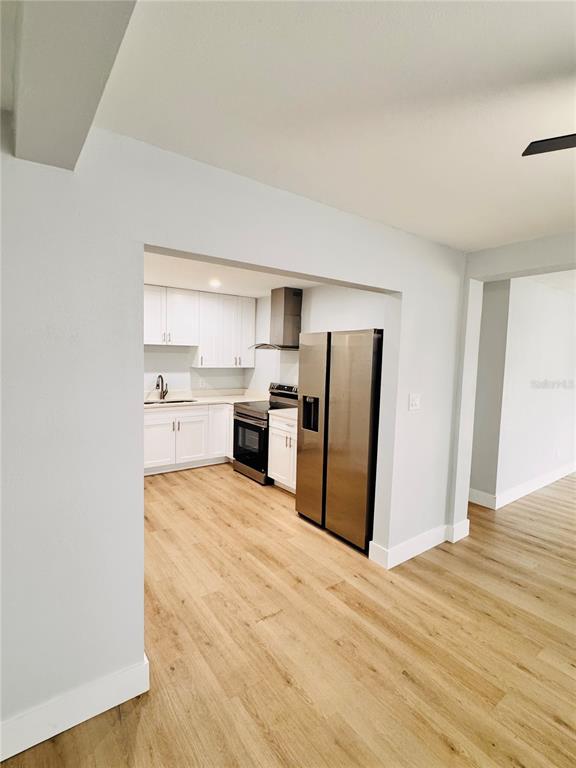 2837 18th Avenue North St. Petersburg, FL 33713 - Photo 7 of 28 a kitchen with stainless steel appliances a refrigerator and a stove top oven