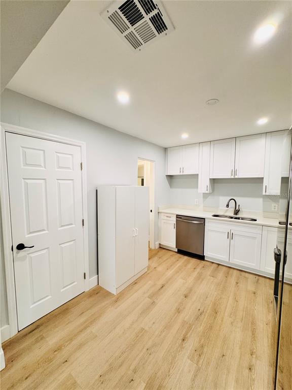 2837 18th Avenue North St. Petersburg, FL 33713 - Photo 9 of 28 a kitchen with stainless steel appliances granite countertop a stove a sink and white cabinets