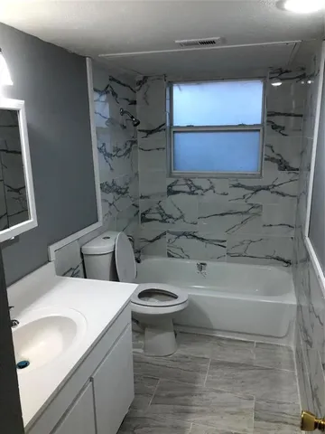 a bathroom with a sink and a toilet