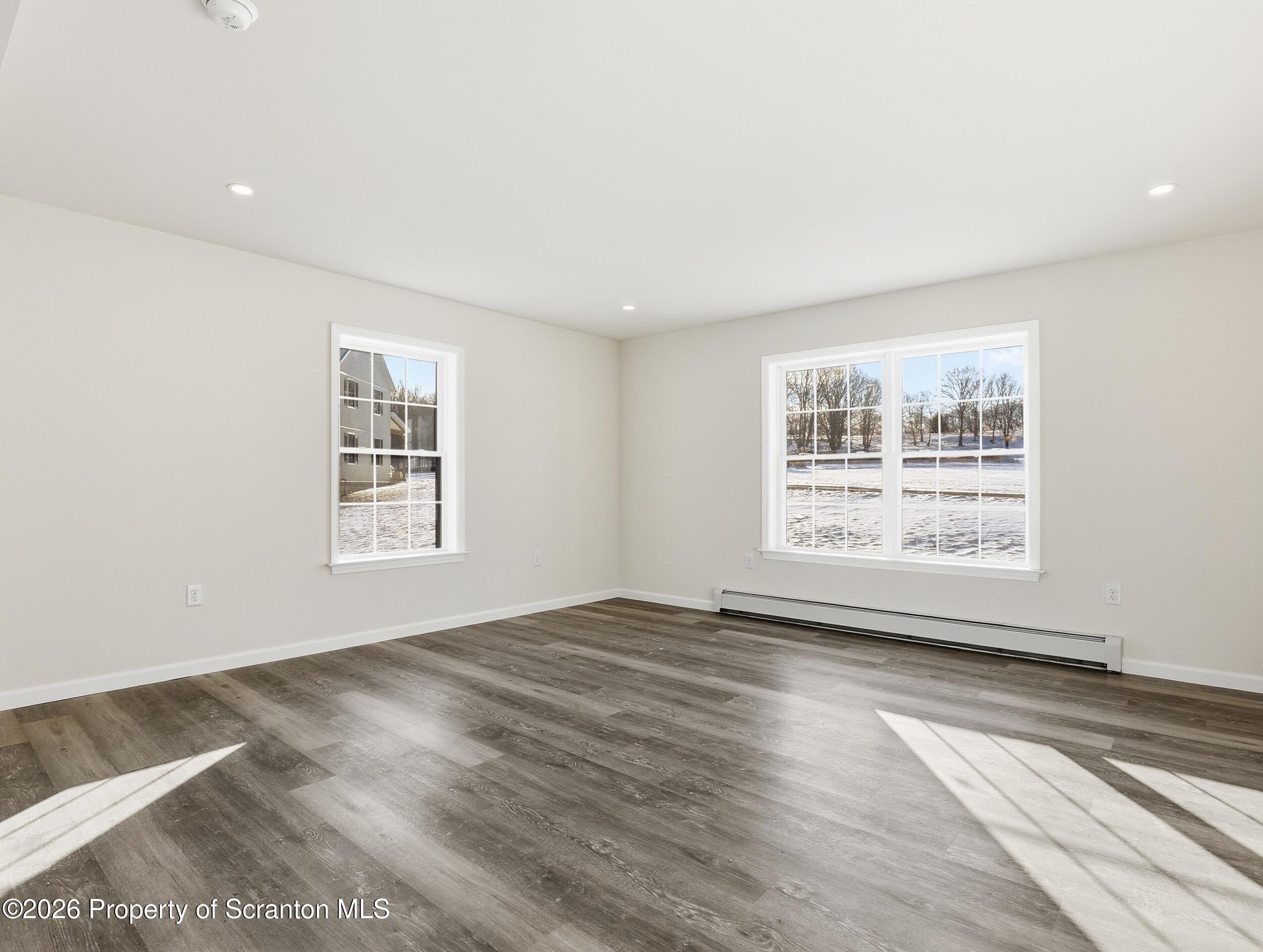 167 Braemar Terrace Tunkhannock, PA 18657 - Photo 12 of 41 a view of an empty room with wooden floor and a window