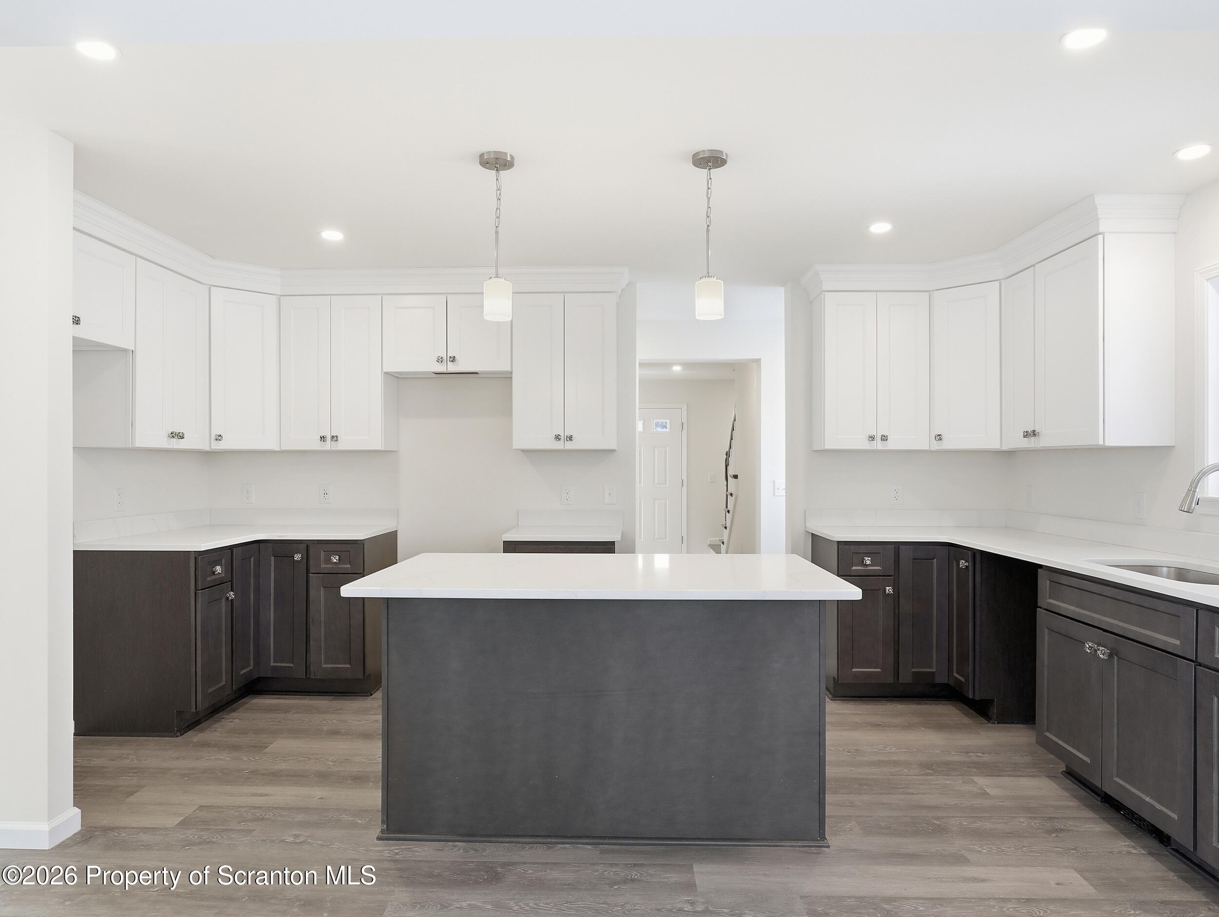 167 Braemar Terrace Tunkhannock, PA 18657 - Photo 13 of 41 a large kitchen with stainless steel appliances kitchen island a cabinets and wooden floor