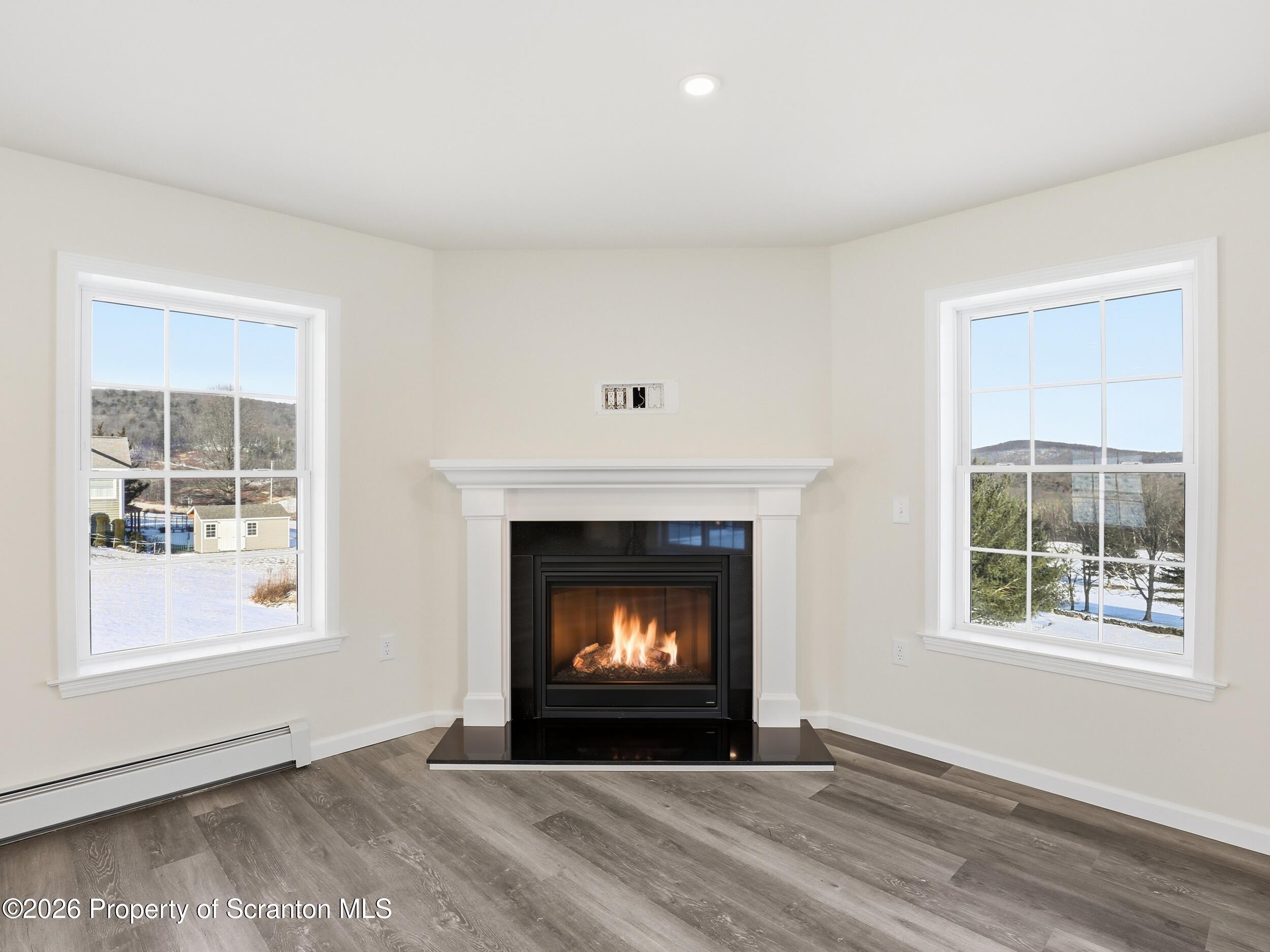 167 Braemar Terrace Tunkhannock, PA 18657 - Photo 20 of 41 a view of an empty room with a fireplace and window