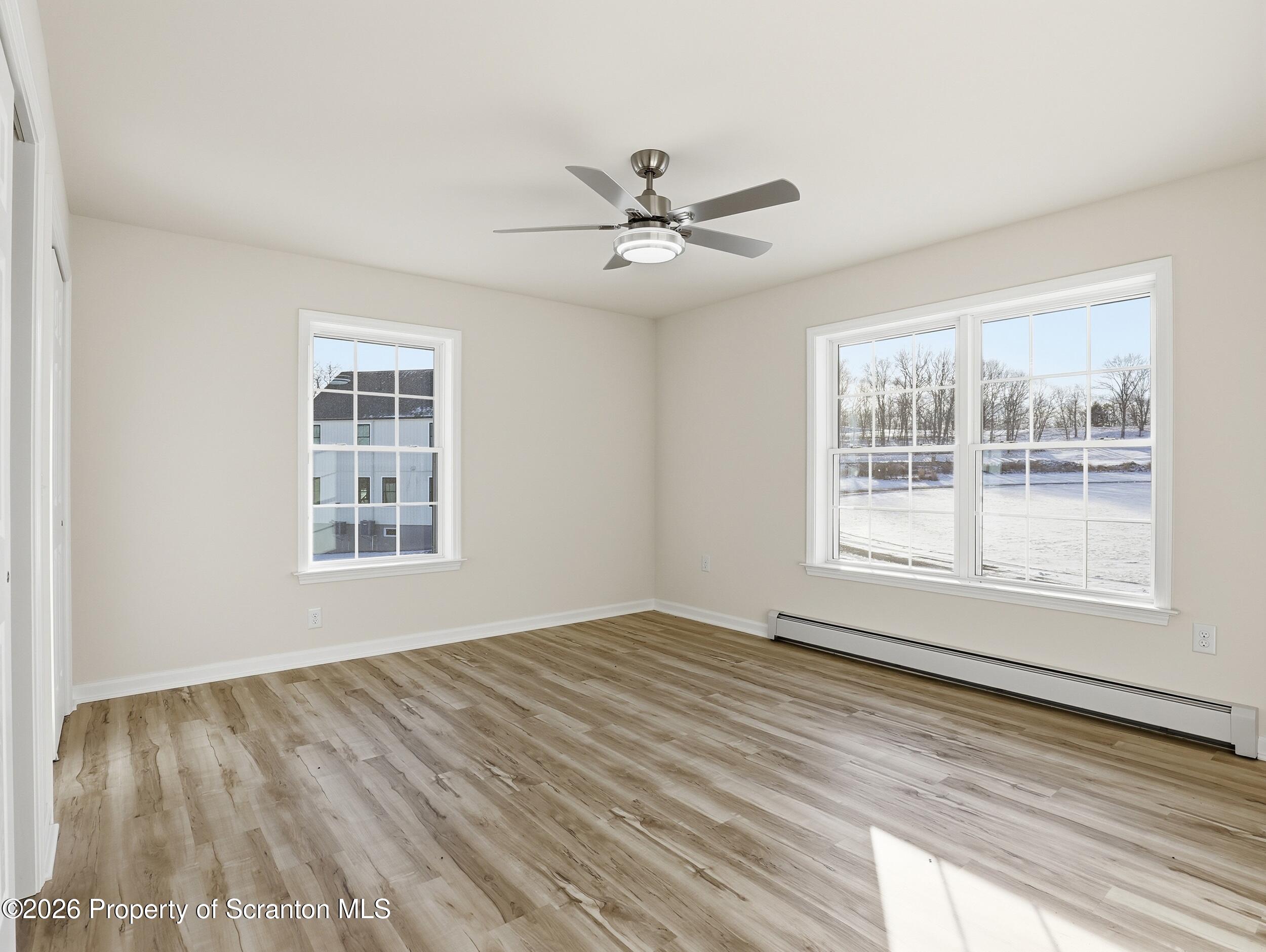 167 Braemar Terrace Tunkhannock, PA 18657 - Photo 25 of 41 a view of an empty room with a window and wooden floor