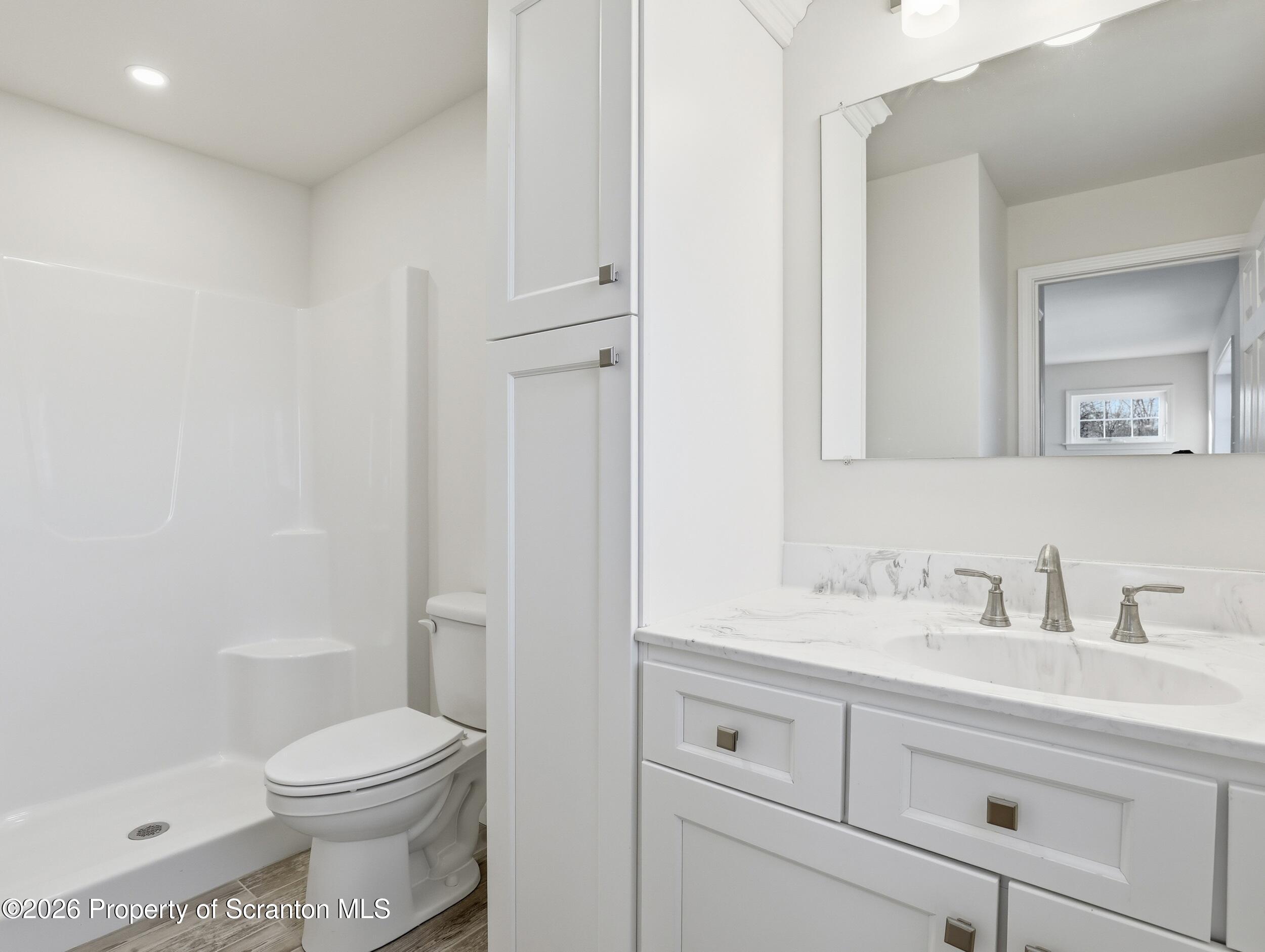 167 Braemar Terrace Tunkhannock, PA 18657 - Photo 27 of 41 a bathroom with a sink a toilet and shower