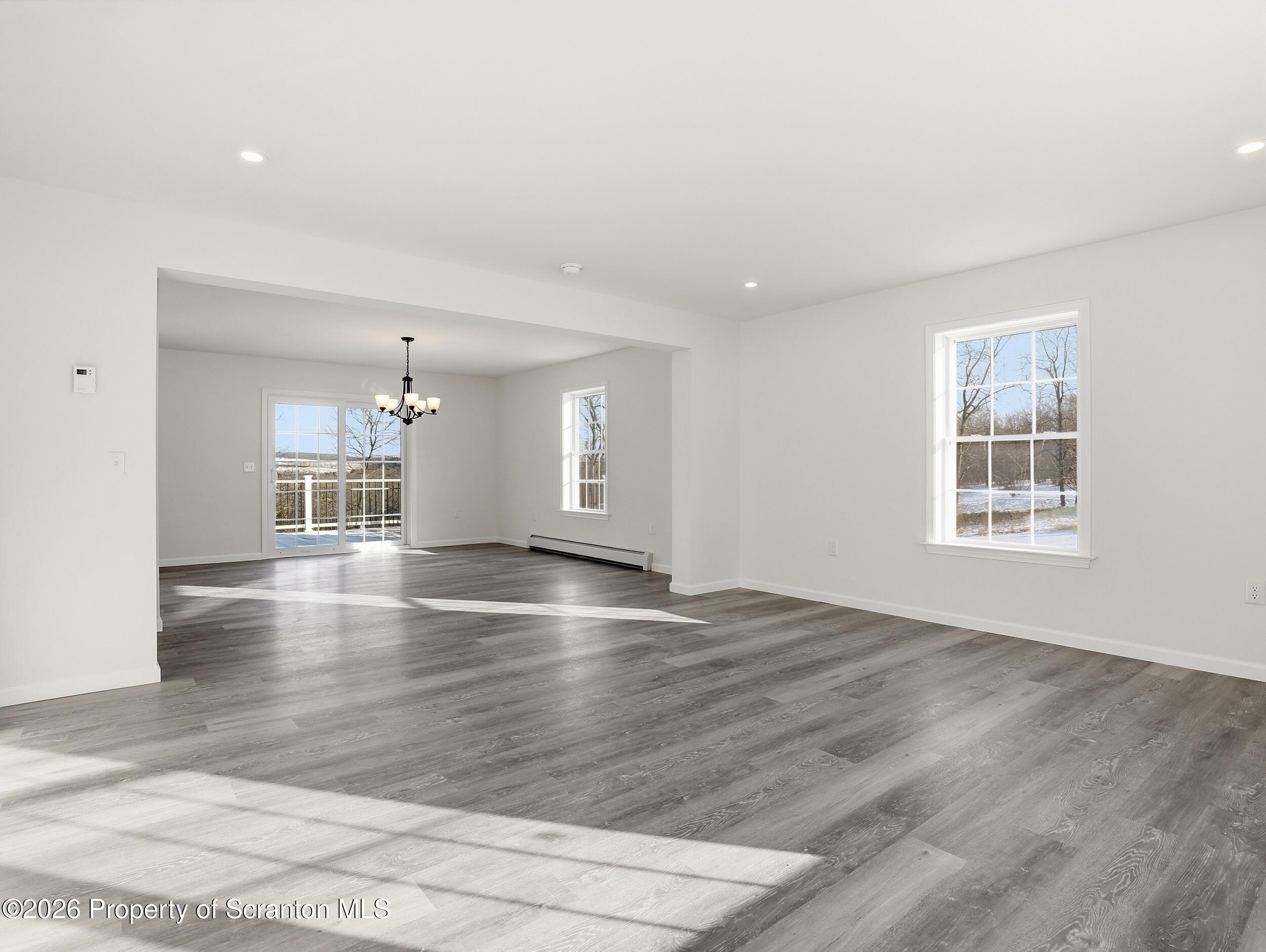 167 Braemar Terrace Tunkhannock, PA 18657 - Photo 9 of 41 an empty room with wooden floor and windows