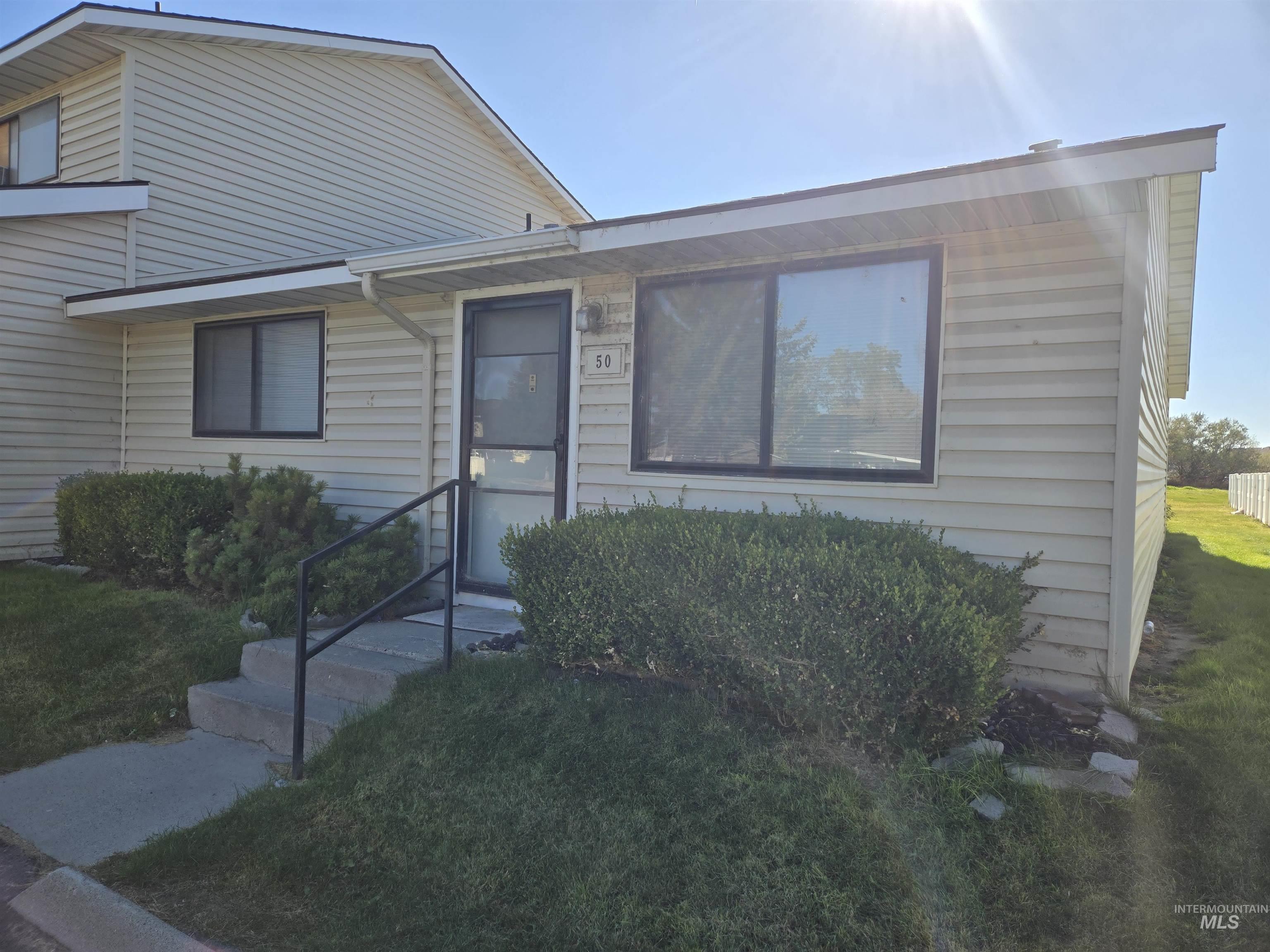 259 Pheasant Road West, Unit 50 Twin Falls, ID 83301 - Photo 2 of 23 View of front of house with a front lawn