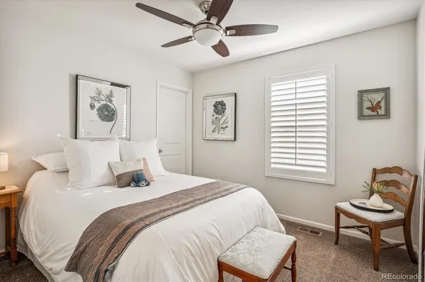 a bedroom with a bed and a chair