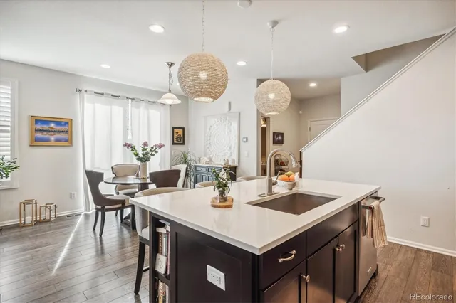 a view of a dining room with furniture wooden floor and chandelier
