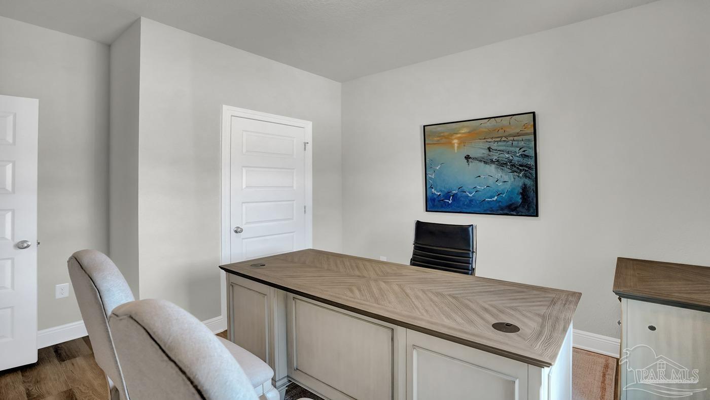 24 Spoonbill Street Cantonment, FL 32533 - Photo 16 of 30 a bedroom with a bed and furniture