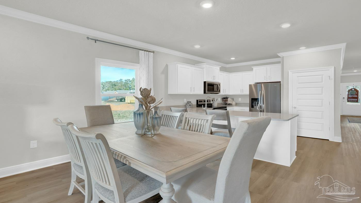 24 Spoonbill Street Cantonment, FL 32533 - Photo 22 of 30 a view of a dining room with furniture