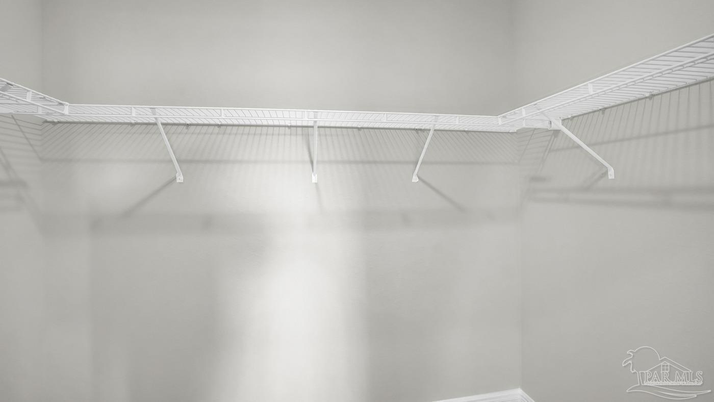 24 Spoonbill Street Cantonment, FL 32533 - Photo 30 of 30 a view of a room with racks on the wall