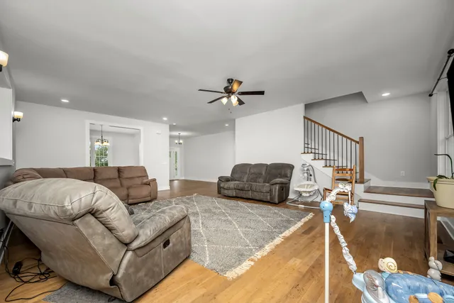 a large kitchen with stainless steel appliances a refrigerator and a stove top oven