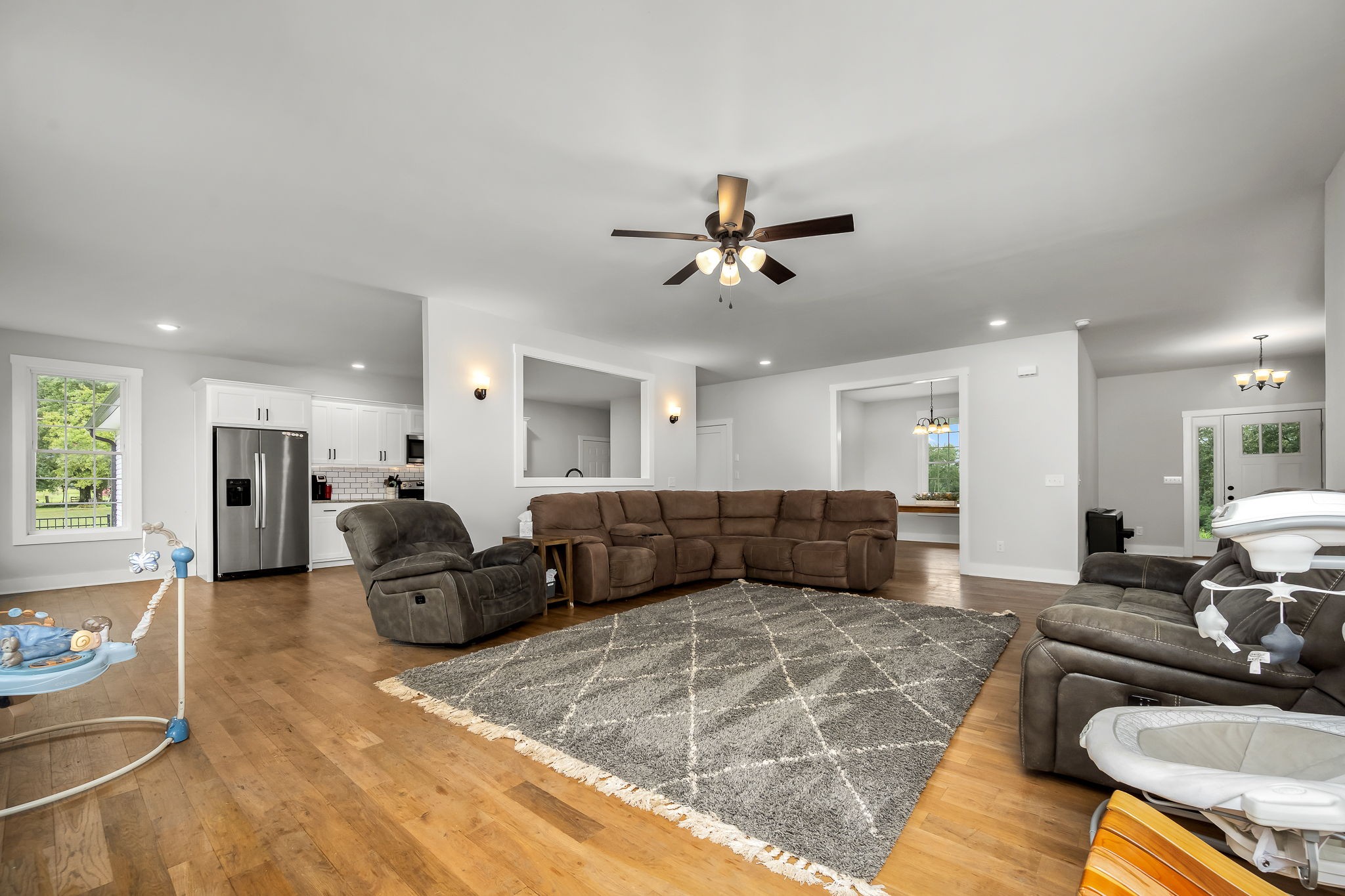 3880 Short Mountain Road Woodbury, TN 37190 - Photo 13 of 59 a living room with furniture kitchen view and a wooden floor