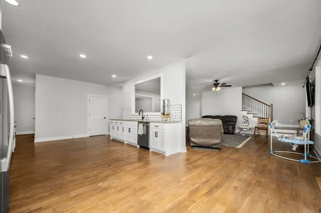 a large kitchen with stainless steel appliances kitchen island granite countertop a large counter top and stainless steel appliances