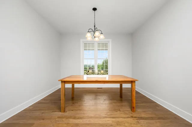 a spacious bedroom with a bed and a window