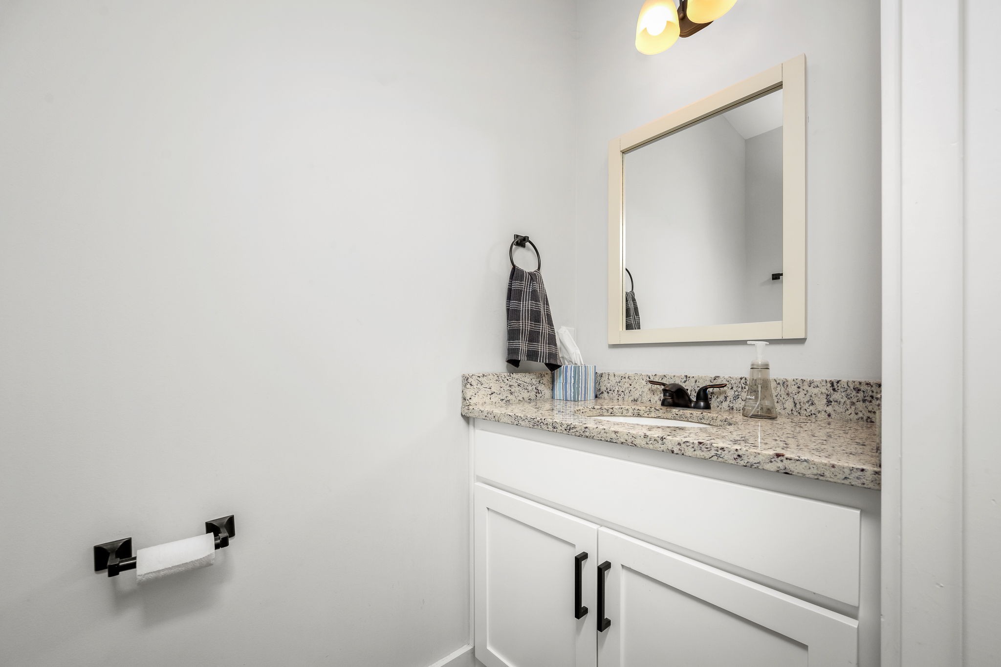 3880 Short Mountain Road Woodbury, TN 37190 - Photo 22 of 59 a bathroom with a granite countertop sink and a mirror