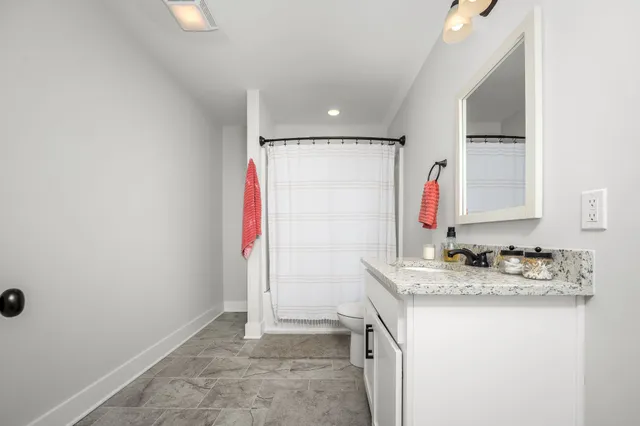 a view of a bike storage and utility room with a window
