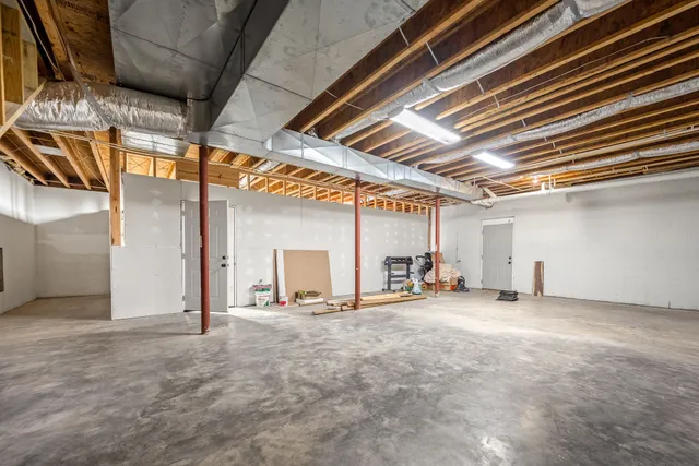 a view of a garage with cars