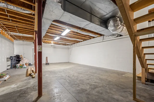 a view of empty room with ceiling fan