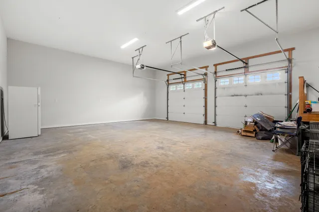a view of a house with swimming pool and a yard