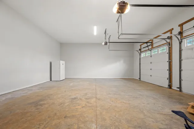 a front view of a house with a garden and yard