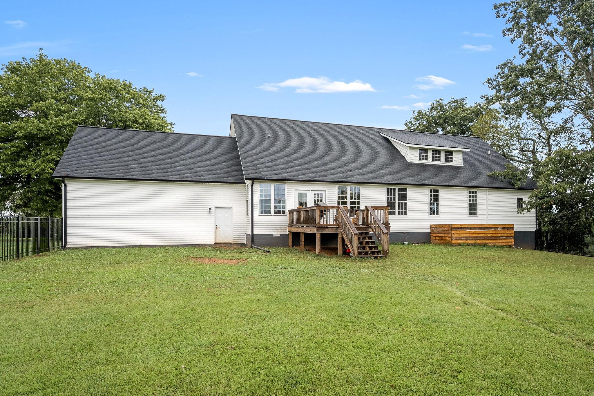 3880 Short Mountain Road Woodbury, TN 37190 - Photo 48 of 59 a view of a house with a yard and sitting area