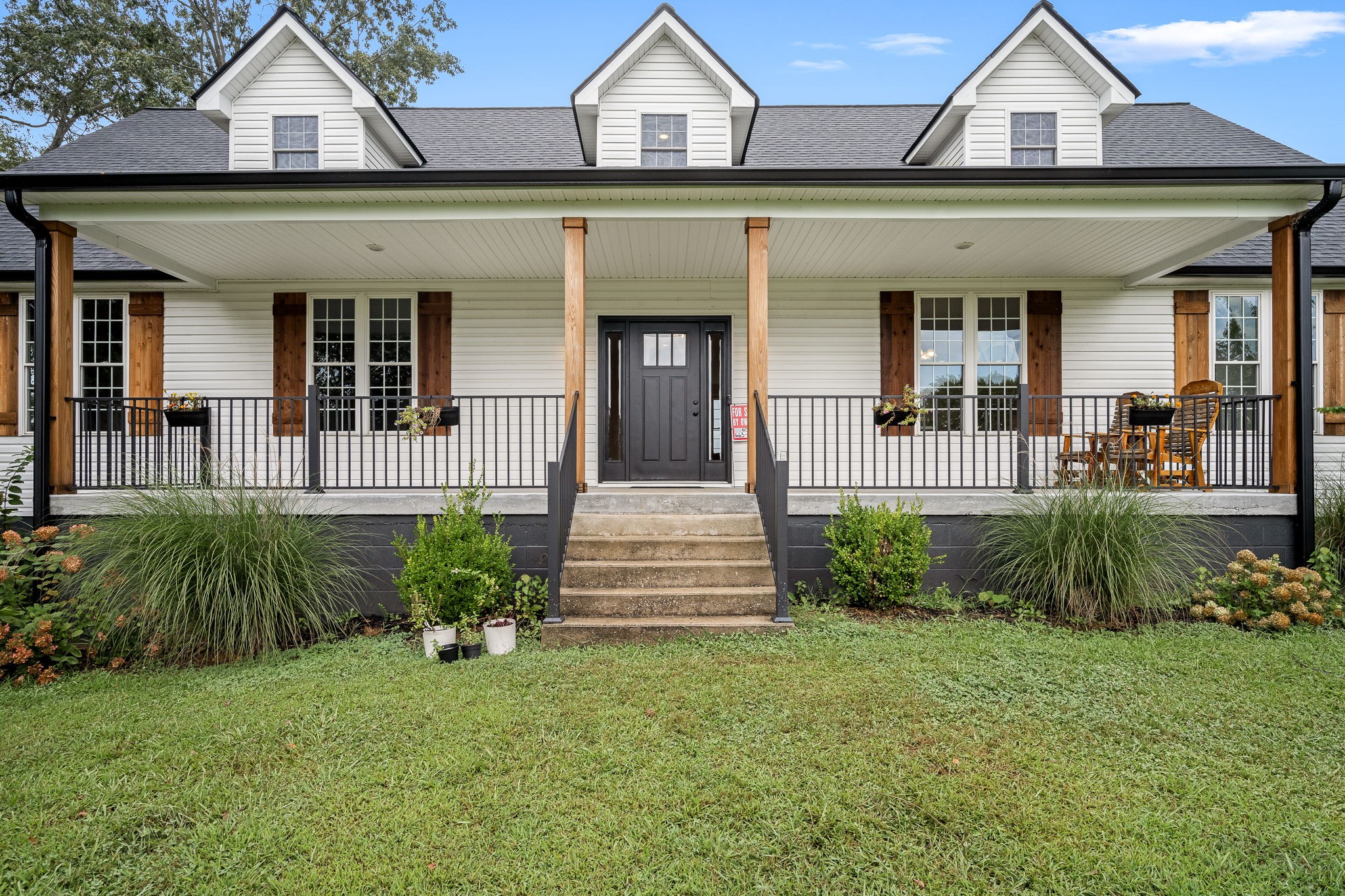 3880 Short Mountain Road Woodbury, TN 37190 - Photo 8 of 59 a front view of a house with a yard