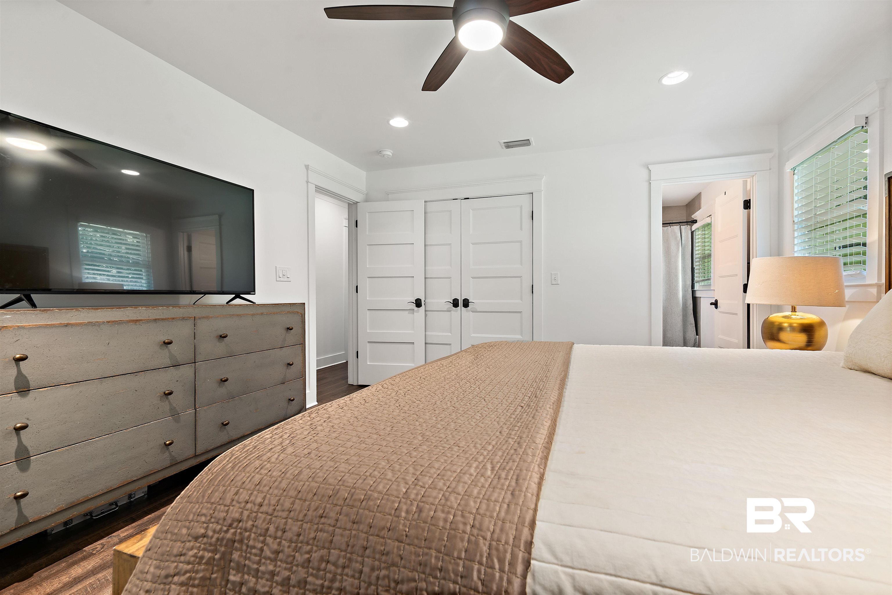 3808 Claridge Road North Mobile, AL 36608 - Photo 24 of 43 Bedroom featuring ceiling fan, hardwood / wood-style floors, and a closet