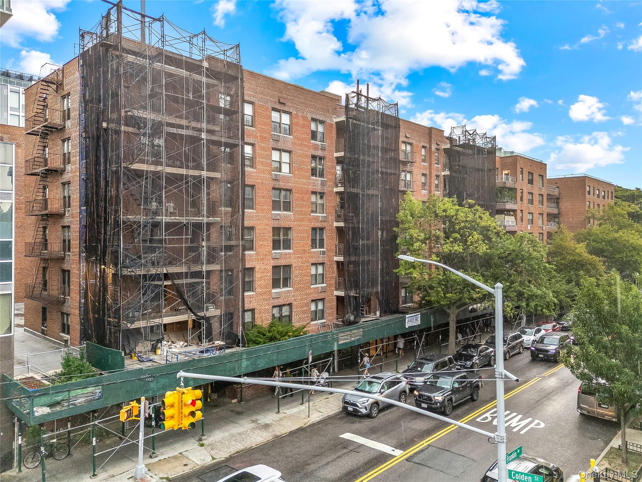 a view of a patio with a table and chairs and potted plants